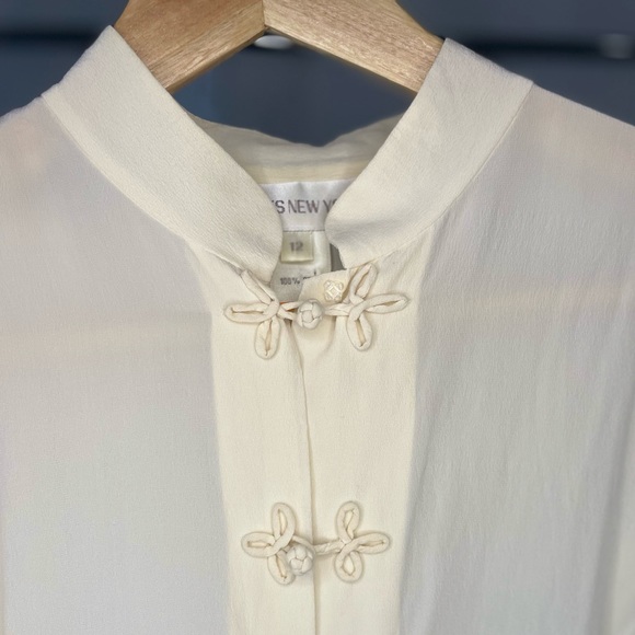 Cream Jones New York blouse. Bow wrap buttons for a delicate & feminine touch. - Picture 3 of 3